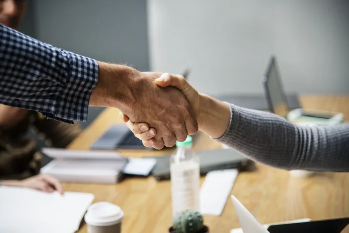 Business people shaking hands in agreement